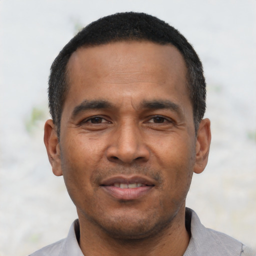 Joyful asian adult male with short  black hair and brown eyes