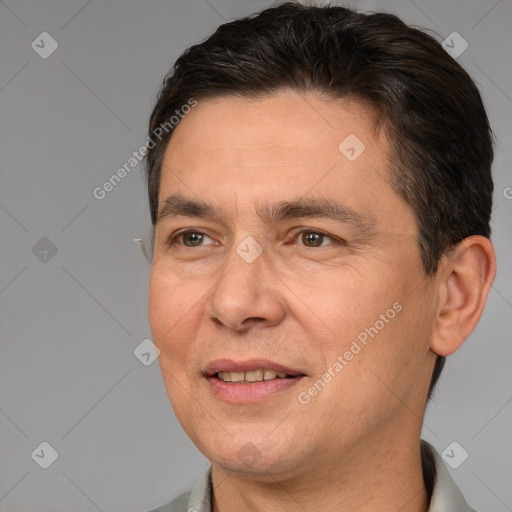 Joyful white adult male with short  brown hair and brown eyes