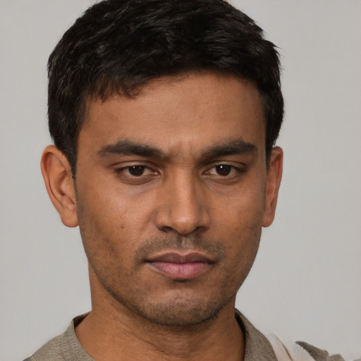 Neutral white young-adult male with short  black hair and brown eyes