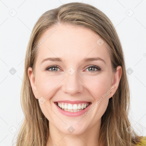 Joyful white young-adult female with long  brown hair and blue eyes