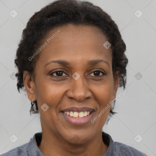 Joyful black adult female with short  brown hair and brown eyes