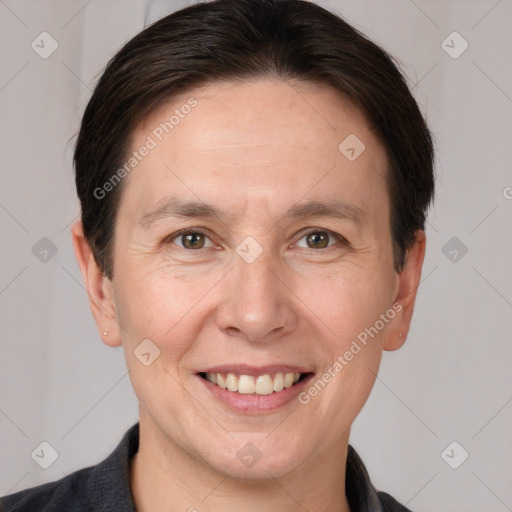 Joyful white adult male with short  brown hair and grey eyes