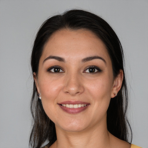 Joyful white young-adult female with long  black hair and brown eyes