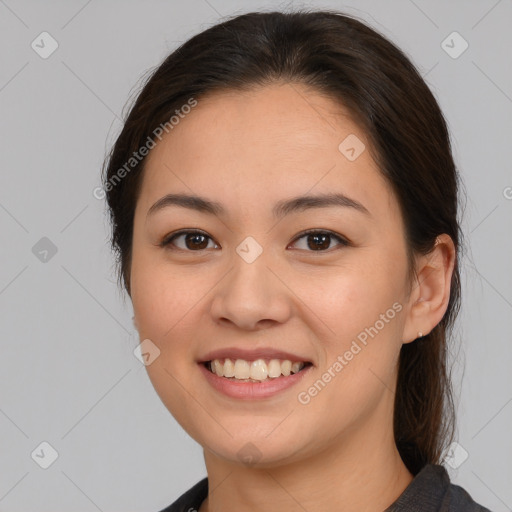 Joyful white young-adult female with medium  brown hair and brown eyes