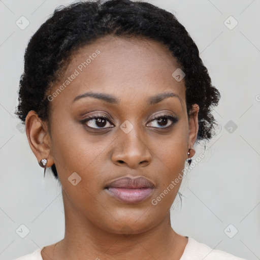 Neutral black young-adult female with short  brown hair and brown eyes