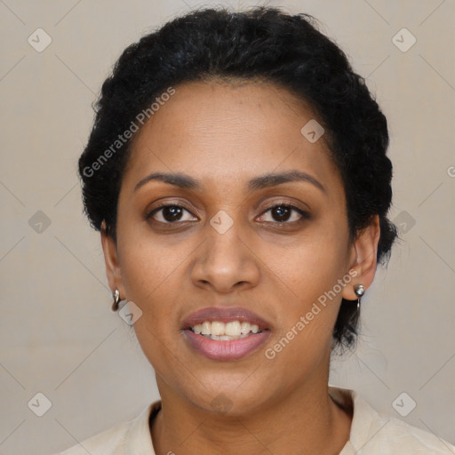 Joyful black young-adult female with short  black hair and brown eyes