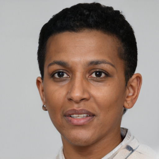Joyful black young-adult female with short  black hair and brown eyes
