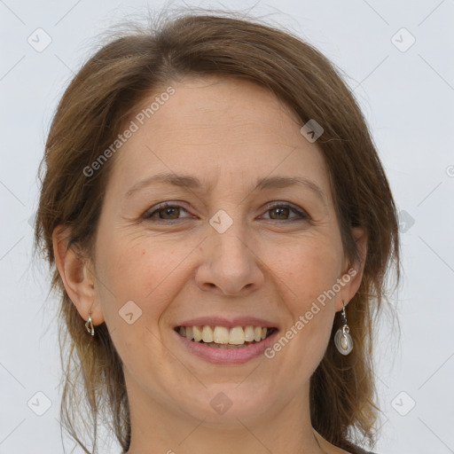 Joyful white adult female with medium  brown hair and brown eyes