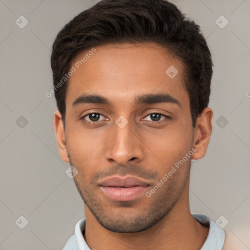 Neutral latino young-adult male with short  black hair and brown eyes