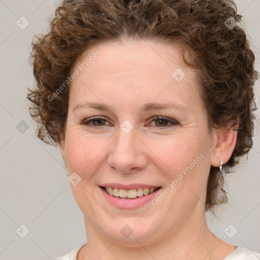 Joyful white young-adult female with medium  brown hair and green eyes