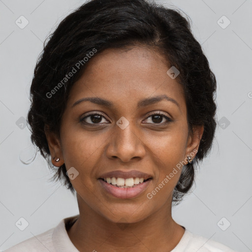 Joyful black young-adult female with medium  brown hair and brown eyes