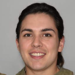 Joyful white young-adult male with medium  brown hair and brown eyes