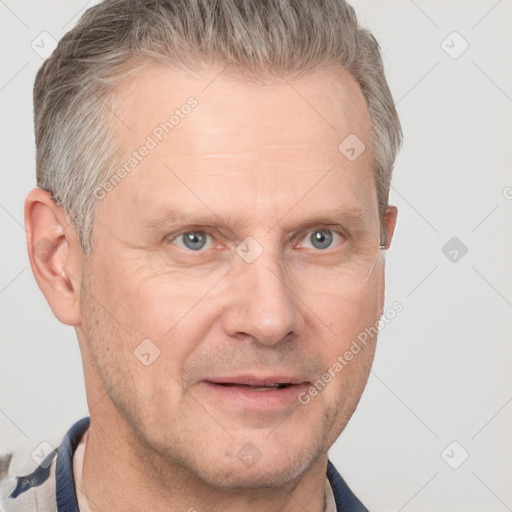 Joyful white adult male with short  brown hair and grey eyes