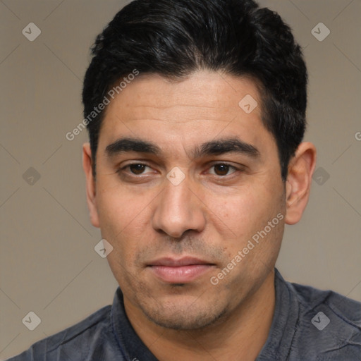 Joyful white adult male with short  black hair and brown eyes