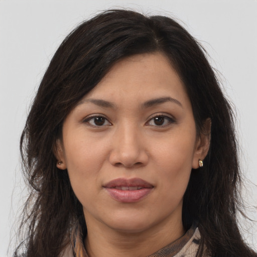 Joyful asian young-adult female with long  brown hair and brown eyes