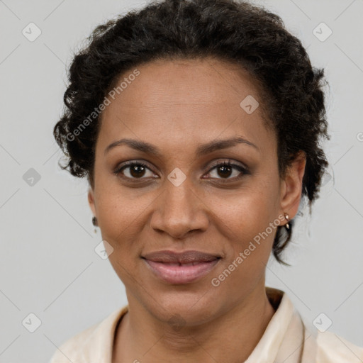 Joyful black adult female with short  brown hair and brown eyes