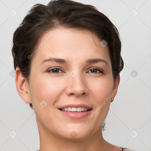 Joyful white young-adult female with short  brown hair and grey eyes