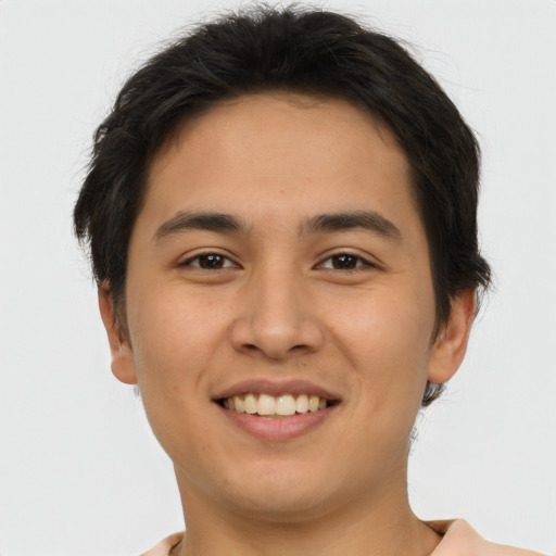 Joyful asian young-adult male with short  brown hair and brown eyes
