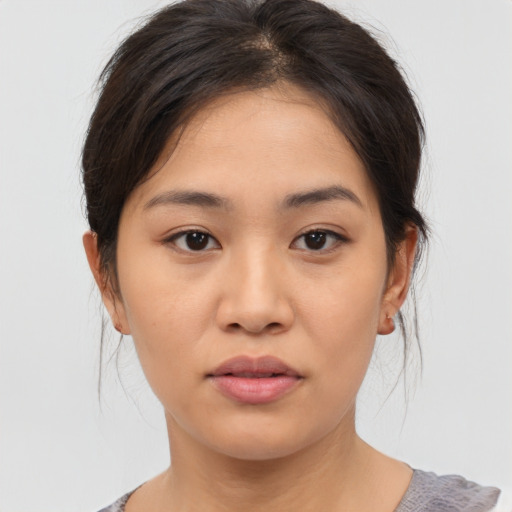Neutral asian young-adult female with medium  brown hair and brown eyes