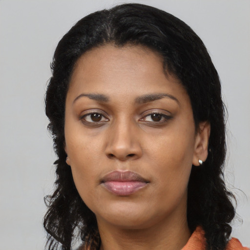 Neutral black young-adult female with long  black hair and brown eyes