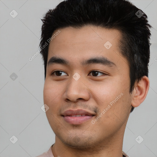 Joyful asian young-adult male with short  black hair and brown eyes