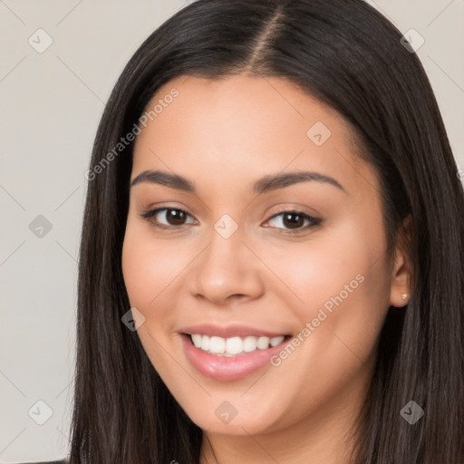 Joyful white young-adult female with long  black hair and brown eyes