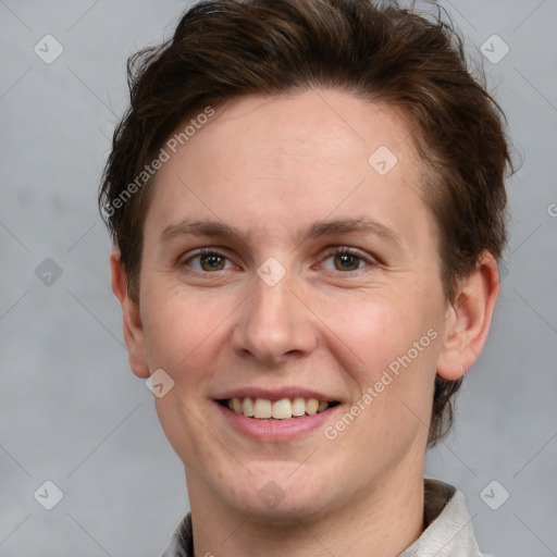 Joyful white young-adult female with short  brown hair and grey eyes