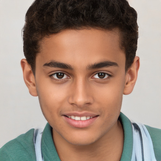 Joyful white child male with short  brown hair and brown eyes