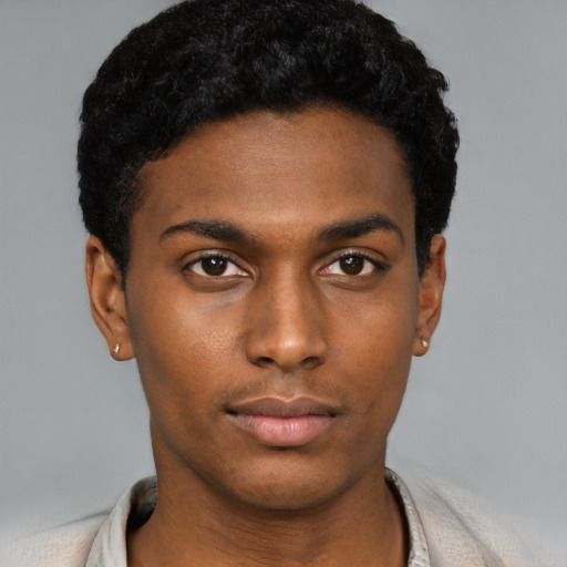 Neutral black young-adult male with short  black hair and brown eyes