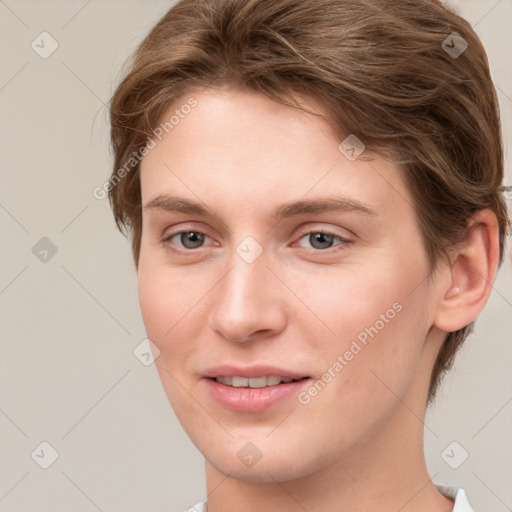 Joyful white young-adult female with short  brown hair and grey eyes