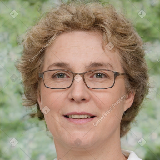 Joyful white adult female with medium  brown hair and green eyes