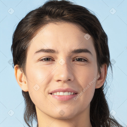 Joyful white young-adult female with medium  brown hair and brown eyes