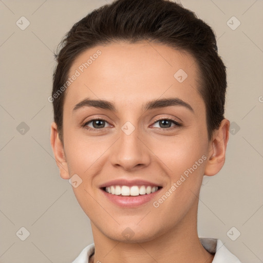 Joyful white young-adult female with short  brown hair and brown eyes