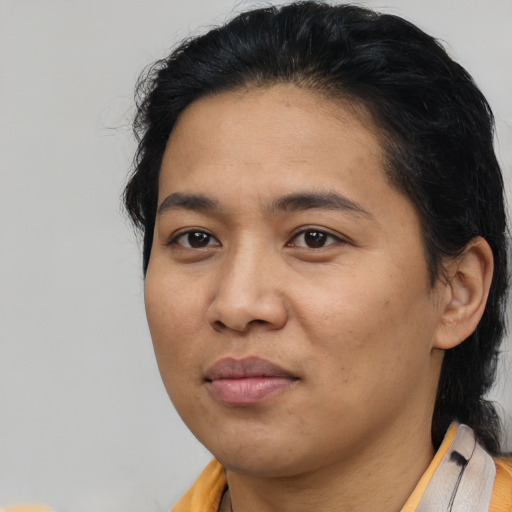Joyful asian young-adult female with medium  black hair and brown eyes