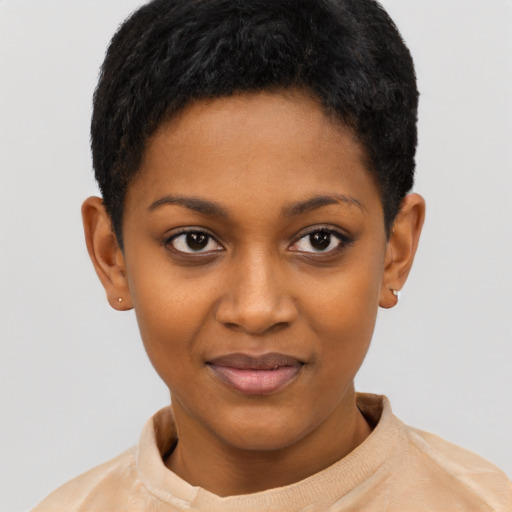Joyful black young-adult female with short  black hair and brown eyes