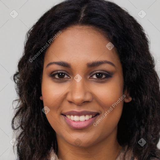 Joyful black young-adult female with long  brown hair and brown eyes