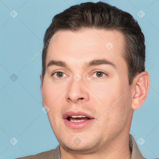 Joyful white young-adult male with short  brown hair and brown eyes