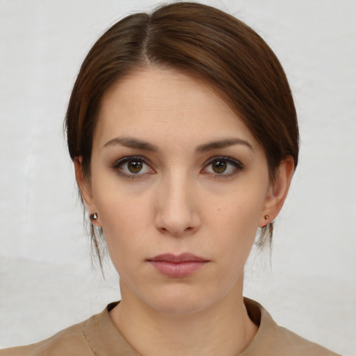 Neutral white young-adult female with medium  brown hair and brown eyes