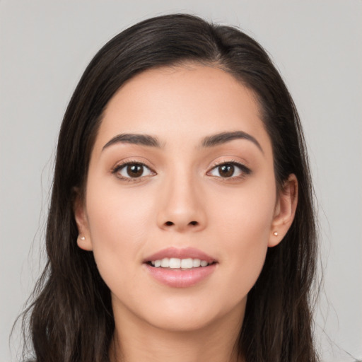 Joyful white young-adult female with long  brown hair and brown eyes