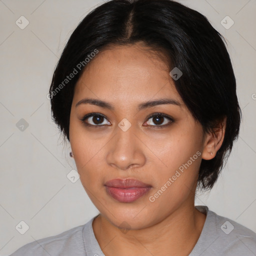 Joyful latino young-adult female with medium  black hair and brown eyes