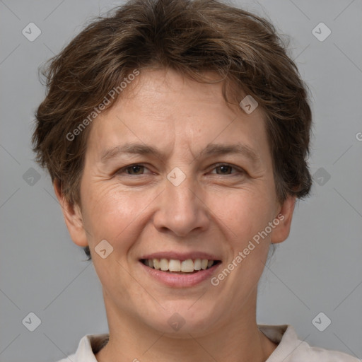 Joyful white adult female with short  brown hair and brown eyes