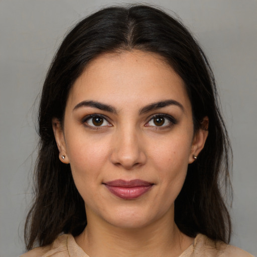 Joyful latino young-adult female with medium  brown hair and brown eyes