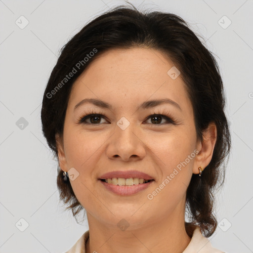 Joyful latino adult female with medium  brown hair and brown eyes