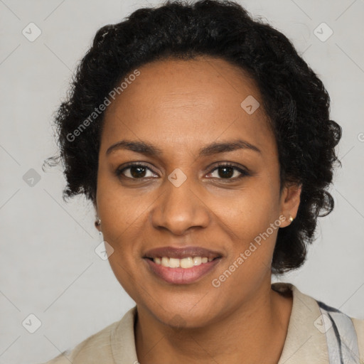 Joyful black young-adult female with long  brown hair and brown eyes