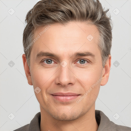 Joyful white adult male with short  brown hair and grey eyes