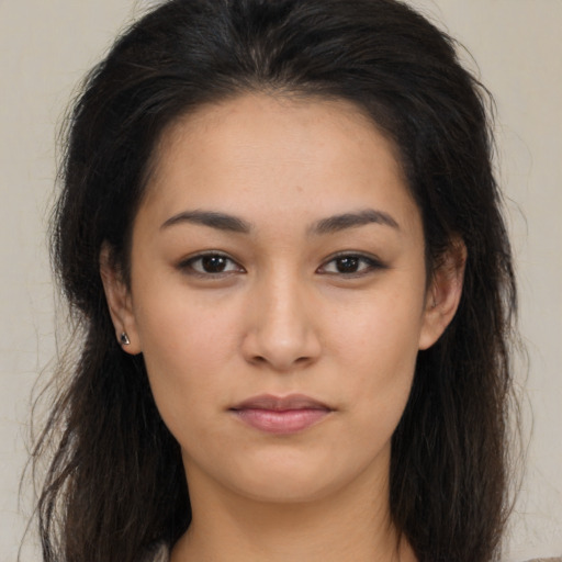 Neutral latino young-adult female with long  brown hair and brown eyes