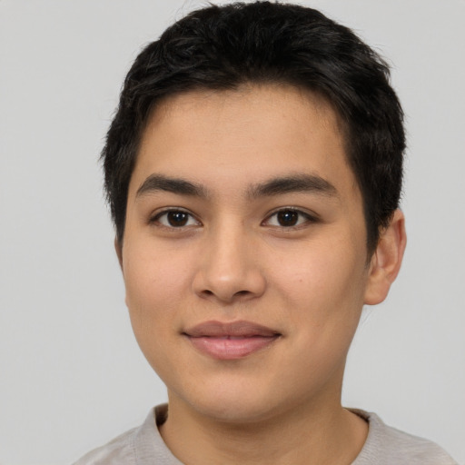 Joyful asian young-adult male with short  black hair and brown eyes