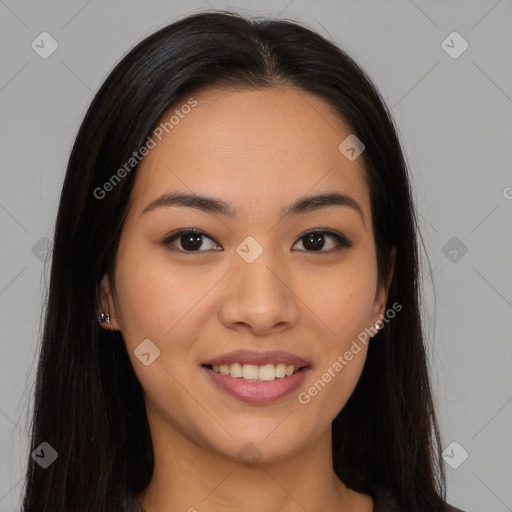 Joyful asian young-adult female with long  brown hair and brown eyes