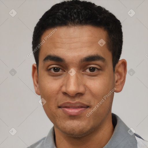 Joyful latino young-adult male with short  black hair and brown eyes