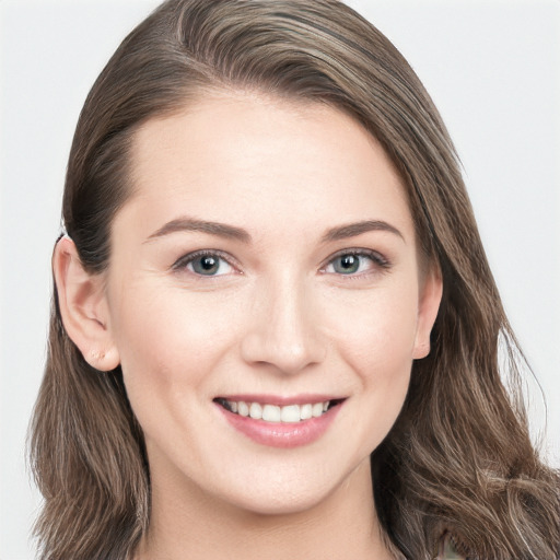 Joyful white young-adult female with long  brown hair and grey eyes